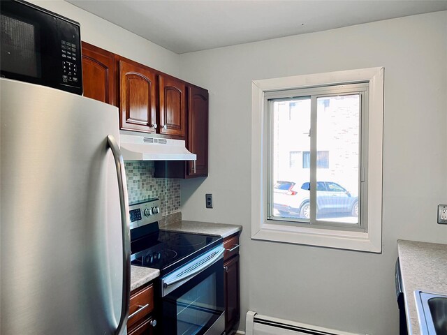 2453 Union Blvd Unit 3A, Islip, NY 11751 - kitchen with under cabinet range hood, freestanding refrigerator, stainless steel range with electric stovetop, black microwave, and baseboard heating