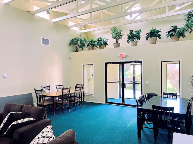 2453 Union Blvd Unit 3A, Islip, NY 11751 - carpeted living room featuring a high ceiling and baseboards