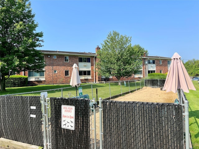 2453 Union Blvd Unit 3A, Islip, NY 11751 - view of front facade featuring a gate, brick siding, and a chimney
