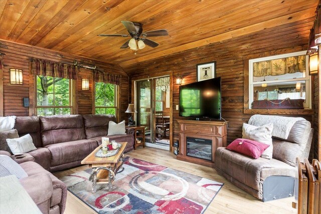 61 Travis Blvd, Catskill, NY 12414 - living room with wood ceiling, ceiling fan, wood finished floors, wood walls, and vaulted ceiling