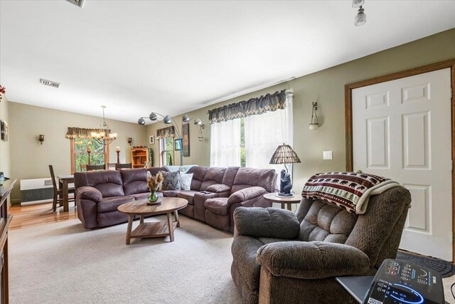61 Travis Blvd, Catskill, NY 12414 - living area featuring a chandelier and light carpet