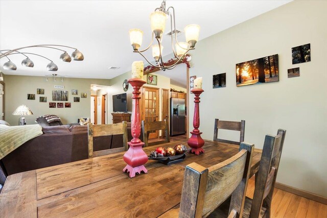 61 Travis Blvd, Catskill, NY 12414 - dining room with light wood finished floors and a chandelier