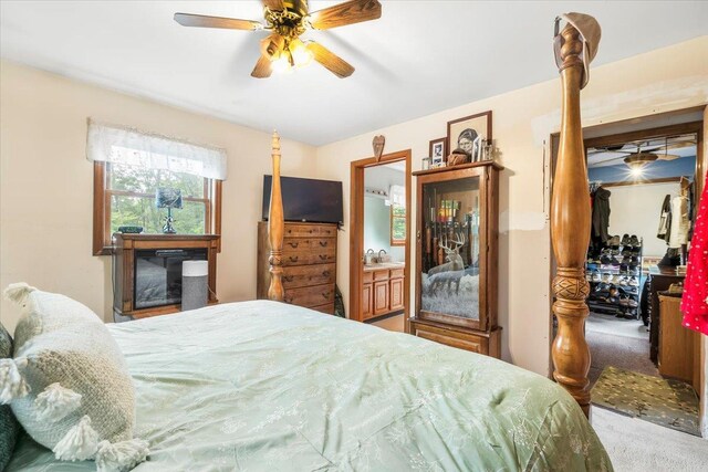 61 Travis Blvd, Catskill, NY 12414 - carpeted bedroom featuring a walk in closet, a ceiling fan, and a closet