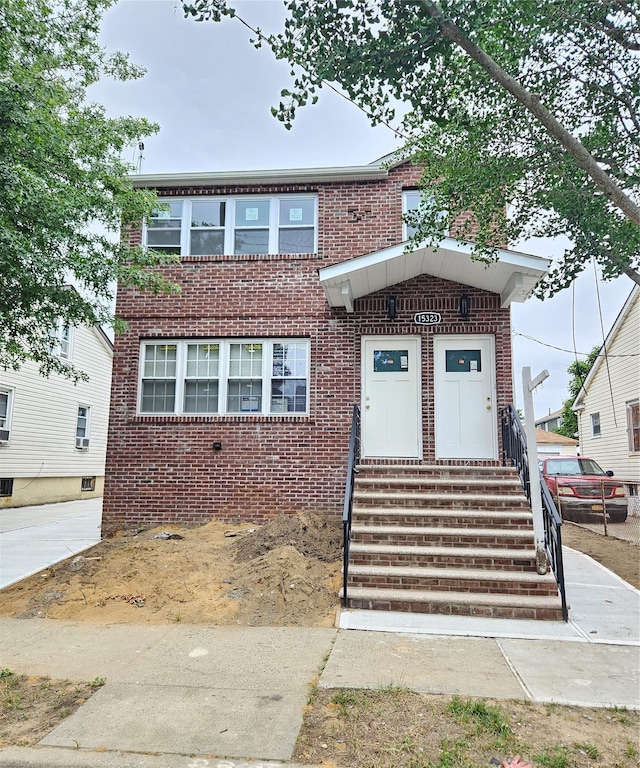 153-23 123rd Ave, Jamaica, NY 11434 - view of front of house with brick siding and entry steps