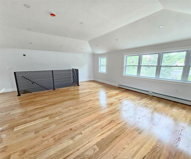 153-23 123rd Ave, Jamaica, NY 11434 - unfurnished room with lofted ceiling, a baseboard heating unit, and light wood-type flooring