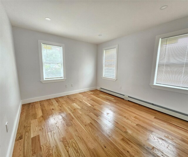 153-23 123rd Ave, Jamaica, NY 11434 - empty room with light wood-style floors, baseboard heating, and recessed lighting