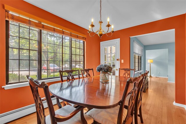 9 Foxwood Dr Unit 4, Pleasantville, NY 10570 - dining area featuring a chandelier, light wood-type flooring, and healthy amount of natural light