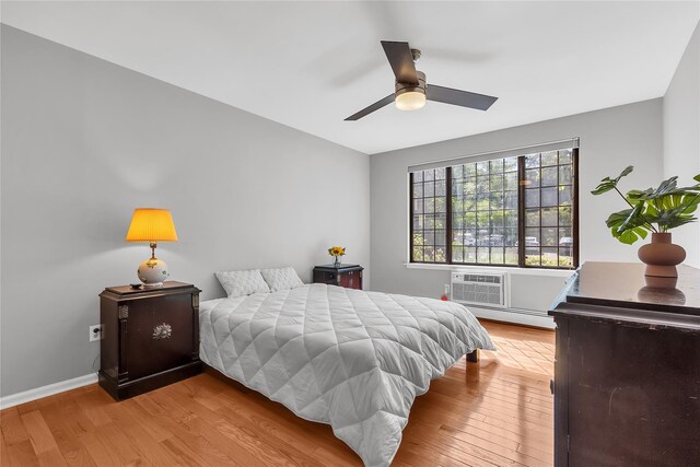 9 Foxwood Dr Unit 4, Pleasantville, NY 10570 - bedroom with baseboard heating, wood finished floors, and ceiling fan