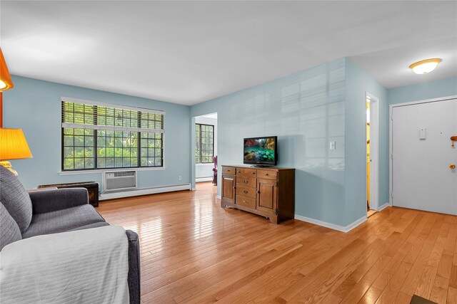 9 Foxwood Dr Unit 4, Pleasantville, NY 10570 - living room featuring light wood-style flooring and a baseboard heating unit