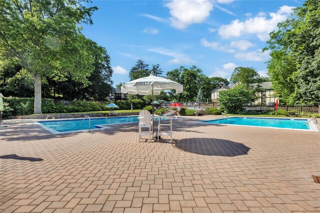 9 Foxwood Dr Unit 4, Pleasantville, NY 10570 - community pool with a patio area
