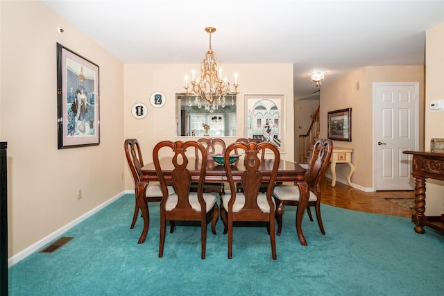 17 Jared Dr, White Plains, NY 10605 - carpeted dining area with a chandelier and baseboards