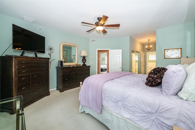 17 Jared Dr, White Plains, NY 10605 - bedroom with light colored carpet, a chandelier, ceiling fan, and ensuite bath
