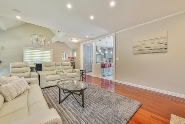 36 W Saint Marks Pl, Valley Stream, NY 11580 - living area featuring wood finished floors, a chandelier, recessed lighting, ornamental molding, and lofted ceiling