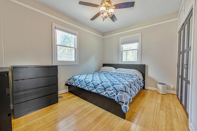 36 W Saint Marks Pl, Valley Stream, NY 11580 - bedroom with a closet, light wood-type flooring, and a ceiling fan