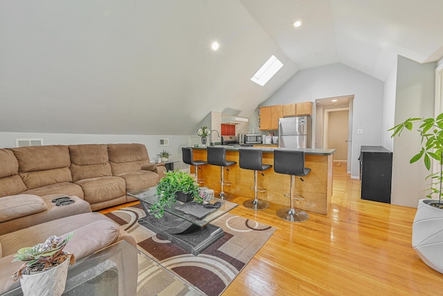 36 W Saint Marks Pl, Valley Stream, NY 11580 - living room with light wood-style flooring and vaulted ceiling