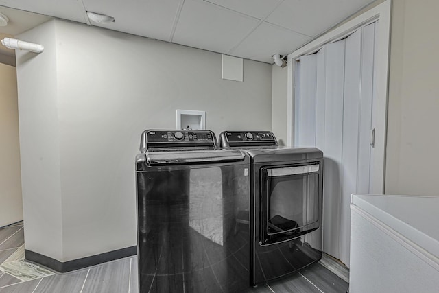 36 W Saint Marks Pl, Valley Stream, NY 11580 - laundry room featuring washer and dryer and wood finished floors