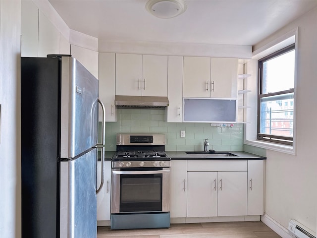 132-30 Sanford Ave Unit 3D, Flushing, NY 11355 - kitchen featuring appliances with stainless steel finishes, extractor fan, a baseboard radiator, open shelves, and dark countertops