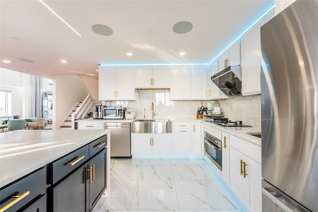 4318 Main St Unit 12A, Flushing, NY 11355 - kitchen featuring appliances with stainless steel finishes, extractor fan, white cabinets, recessed lighting, and decorative backsplash