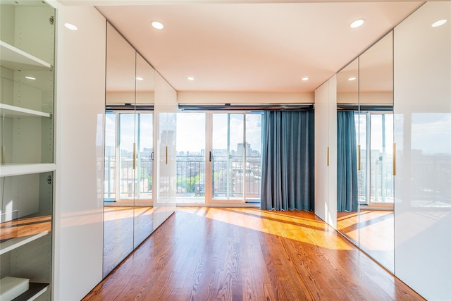 4318 Main St Unit 12A, Flushing, NY 11355 - unfurnished room featuring wood finished floors, a city view, and recessed lighting