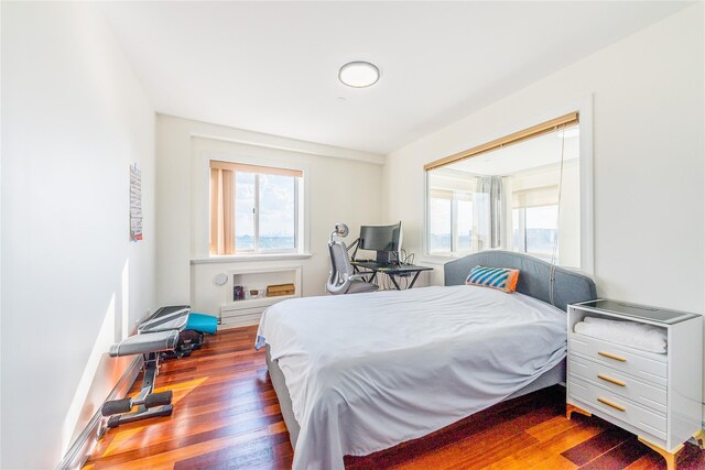 4318 Main St Unit 12A, Flushing, NY 11355 - bedroom with multiple windows and wood finished floors