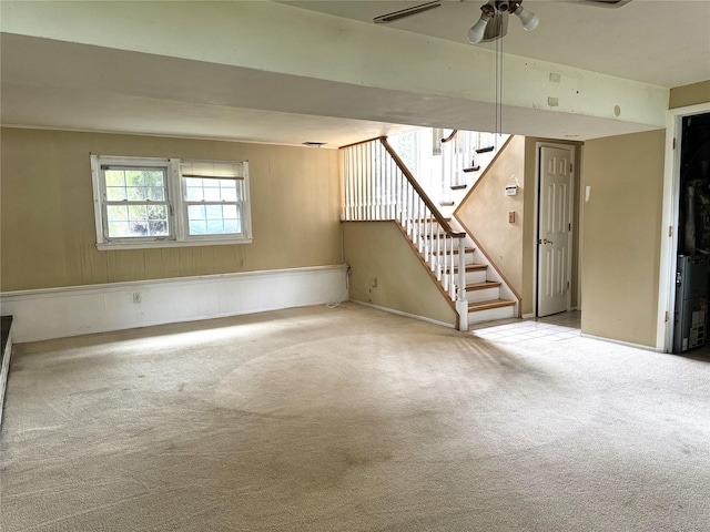 22 Kennedy Dr, Centereach, NY 11720 - unfurnished living room with carpet, stairs, and ceiling fan