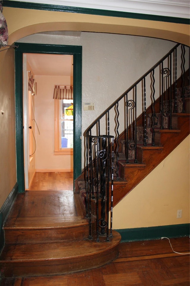 30-12 84th St, East Elmhurst, NY 11370 - staircase featuring arched walkways and wood finished floors