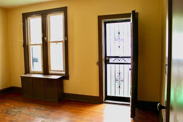 30-12 84th St, East Elmhurst, NY 11370 - foyer featuring wood finished floors and radiator heating unit