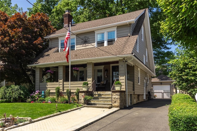 58 Hillside Ave, New Rochelle, NY 10801 - view of front of home featuring covered porch, a chimney, an outbuilding, a garage, and roof with shingles