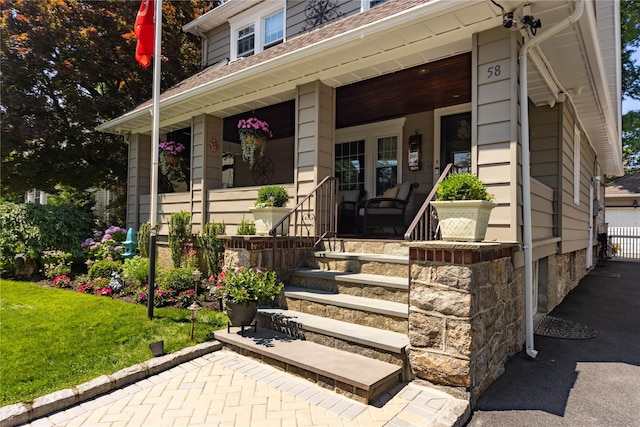 58 Hillside Ave, New Rochelle, NY 10801 - doorway to property featuring a porch and a yard