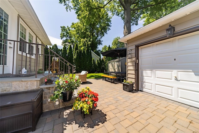 58 Hillside Ave, New Rochelle, NY 10801 - view of patio with an outdoor structure and a garage