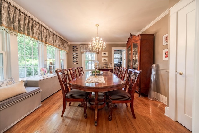 58 Hillside Ave, New Rochelle, NY 10801 - dining area with a chandelier, healthy amount of natural light, light wood-style flooring, and crown molding