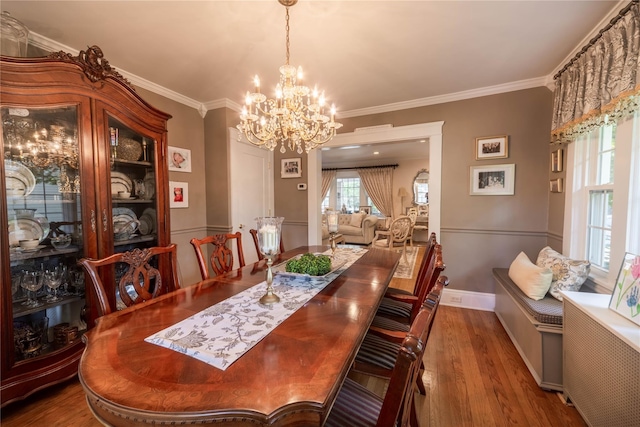 58 Hillside Ave, New Rochelle, NY 10801 - dining area with a chandelier, wood finished floors, and crown molding