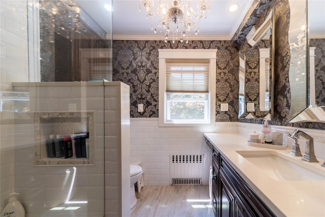 58 Hillside Ave, New Rochelle, NY 10801 - full bathroom with radiator, vanity, wallpapered walls, crown molding, and tile walls