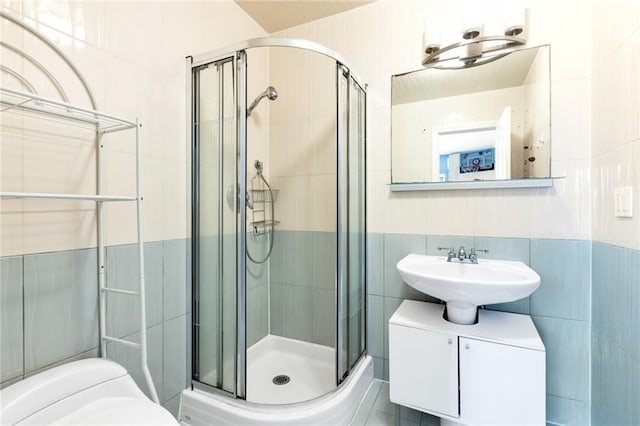 135 28th Ave Unit 2A, Brooklyn, NY 11214 - bathroom with tile walls and a shower stall