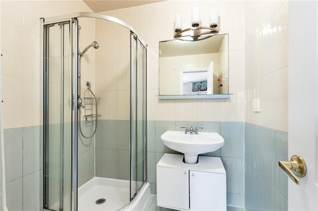135 28th Ave Unit 2A, Brooklyn, NY 11214 - full bathroom with tile walls and a stall shower