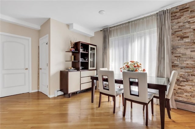135 28th Ave Unit 2A, Brooklyn, NY 11214 - dining space with light wood-type flooring and baseboard heating