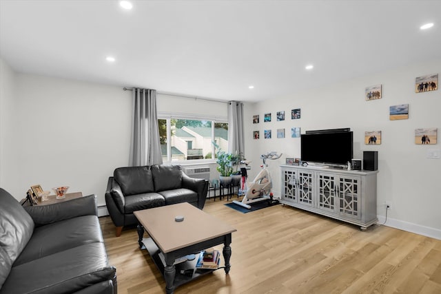 42 Richmond Blvd Unit 4B, Ronkonkoma, NY 11779 - living room featuring recessed lighting, wood finished floors, baseboard heating, a baseboard radiator, and a wall mounted AC