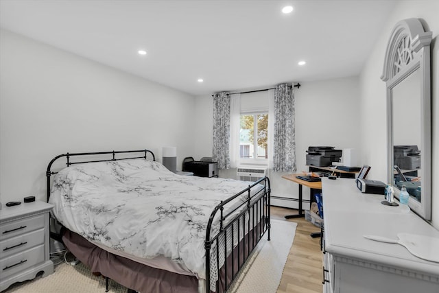 42 Richmond Blvd Unit 4B, Ronkonkoma, NY 11779 - bedroom with recessed lighting, light wood-style flooring, a baseboard radiator, and a wall mounted AC
