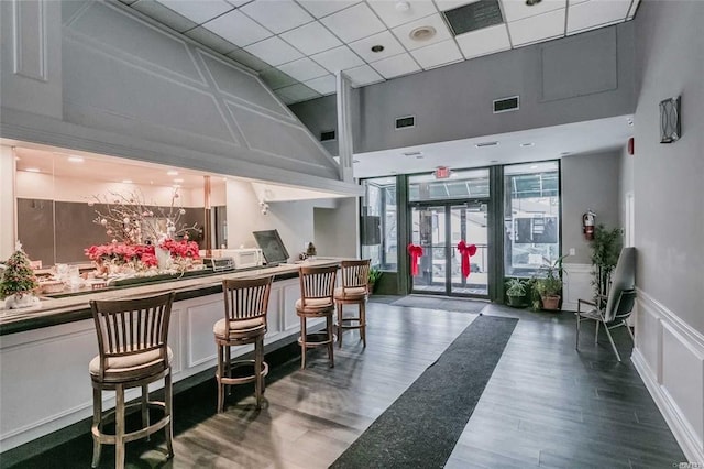 42 Richmond Blvd Unit 4B, Ronkonkoma, NY 11779 - lobby featuring a towering ceiling, a paneled ceiling, and a decorative wall