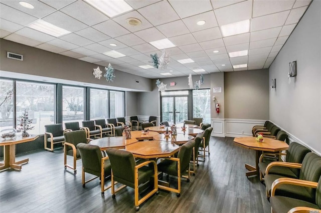 42 Richmond Blvd Unit 4B, Ronkonkoma, NY 11779 - dining area with wainscoting, wood finished floors, and a drop ceiling