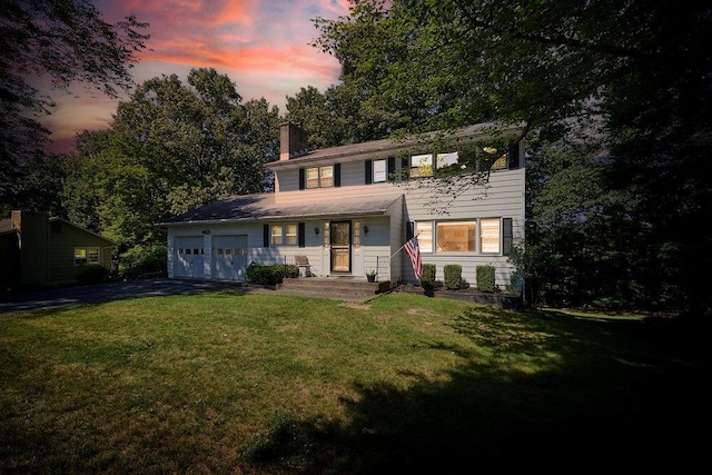 152 Bart Dr, Poughkeepsie, NY 12603 - view of front of home with a chimney, driveway, an attached garage, and a lawn