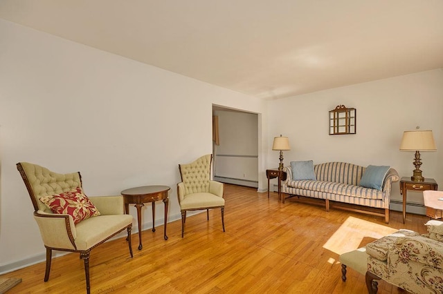 152 Bart Dr, Poughkeepsie, NY 12603 - sitting room featuring a baseboard radiator and light wood finished floors