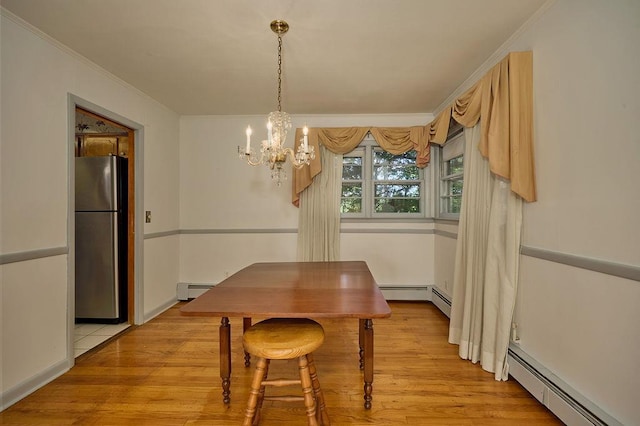 152 Bart Dr, Poughkeepsie, NY 12603 - dining room with a chandelier, a baseboard radiator, crown molding, and light wood-type flooring