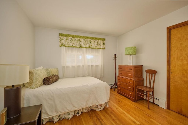 152 Bart Dr, Poughkeepsie, NY 12603 - bedroom featuring wood finished floors and a baseboard heating unit