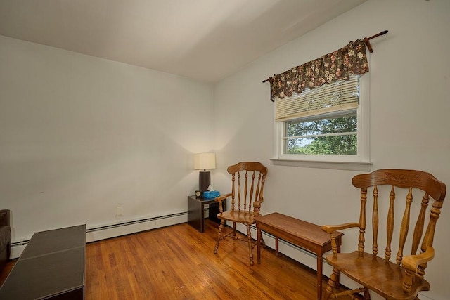 152 Bart Dr, Poughkeepsie, NY 12603 - living area with baseboard heating, wood finished floors, and a baseboard heating unit