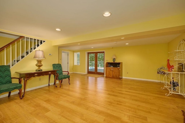 152 Bart Dr, Poughkeepsie, NY 12603 - sitting room featuring wood finished floors, stairway, recessed lighting, and french doors