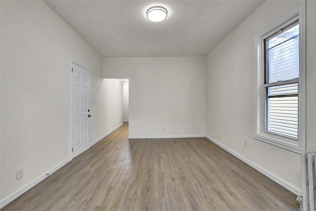 58-60 78th Ave, Glendale, NY 11385 - unfurnished room featuring light wood-style floors and baseboards
