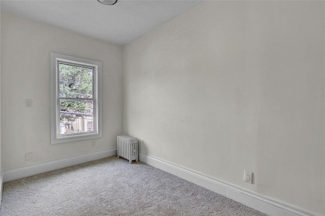 58-60 78th Ave, Glendale, NY 11385 - spare room with radiator heating unit and carpet