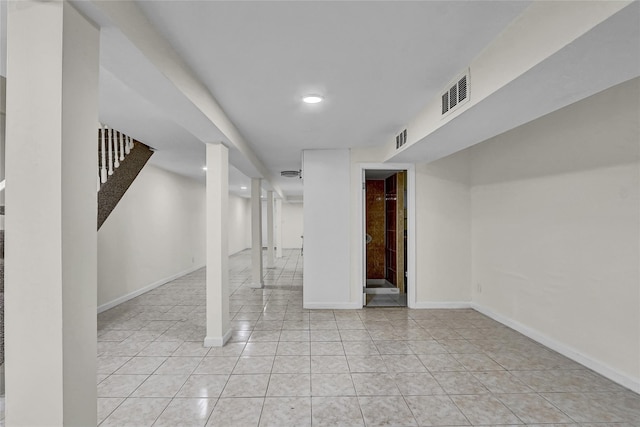 58-60 78th Ave, Glendale, NY 11385 - finished below grade area featuring recessed lighting, stairway, and light tile patterned floors