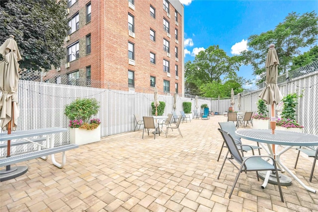 209-10 41st Ave Unit 2J, Bayside, NY 11361 - fenced backyard with a patio area and outdoor dining area